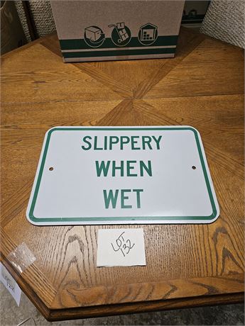 "Slippery When Wet" Metal Sign