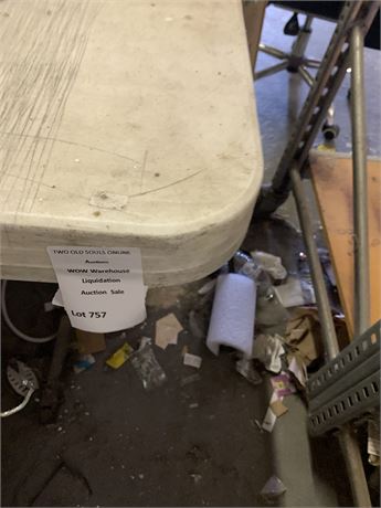 8’ Plastic Table (Some Damage) Table only no contents