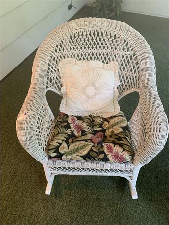 White Wicker Rocking Chair With Chair Pad and White Throw Pillow