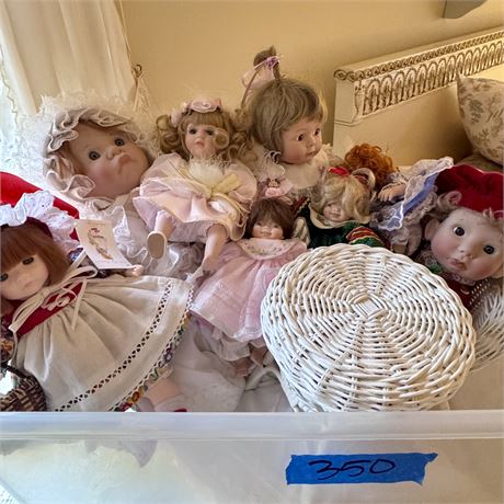 Tote of Mixed Porcelain Dolls and Doll Sized Wicker Table & Chairs