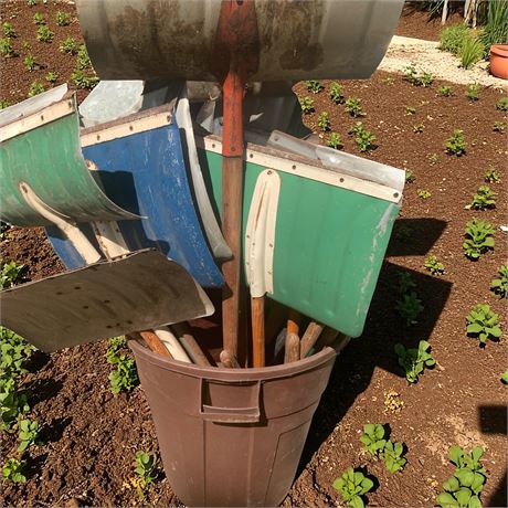 Plastic Trash Can Barrel Full Of Snow Shovels