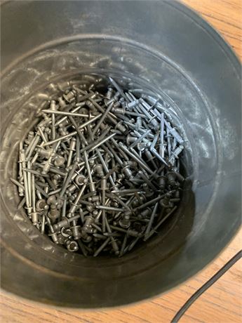 Pop Rivets in Metal Bucket