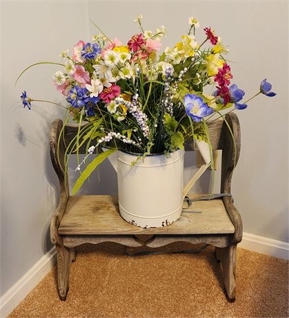 Decorative small bench, artificial flower arrangement