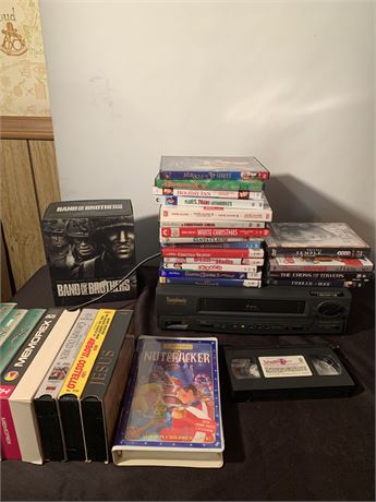 Symphonic VCR With Misc Classic Movies VHS Tapes And Christmas Themed DVDs