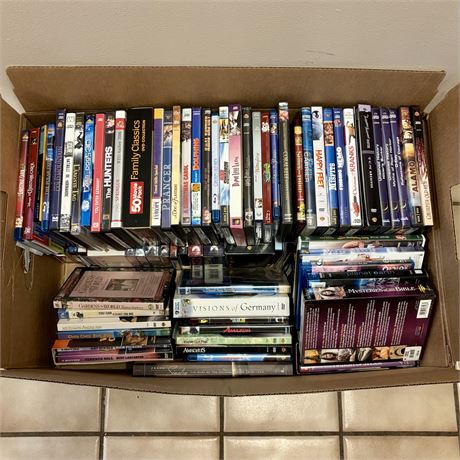 Large Box Filled with DVDs and VHS Tapes