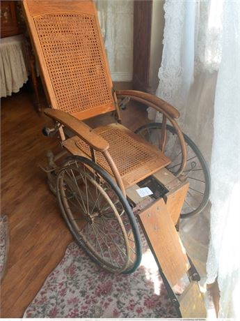 Antique Wooden Wheelchair W/Woven Cane Seat/Back, Metal Wheels & Wood Foot Rests