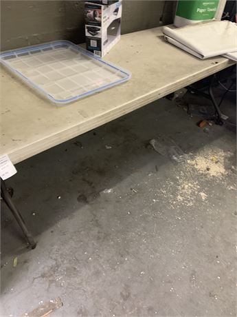 8’ Plastic Table (Some Damage) Table only no contents