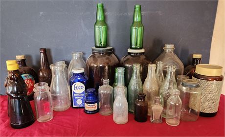 Tote of vintage bottles